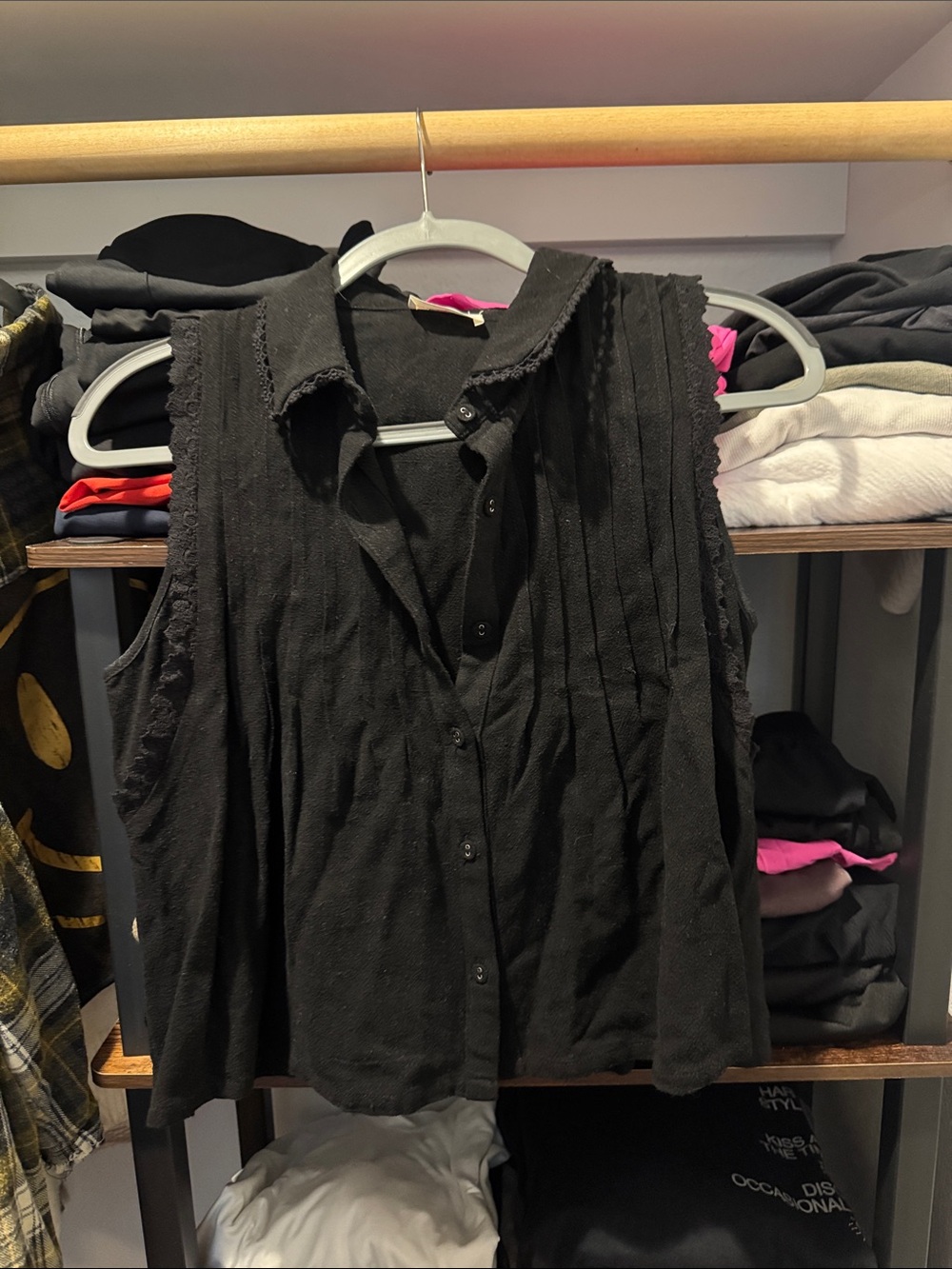 Sleeveless Black Button-Front Collared Blouse